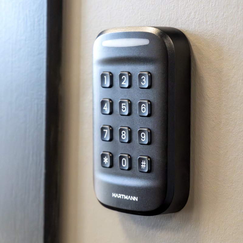 Hartmann proximity reader with proximity card presented at a secure door entry